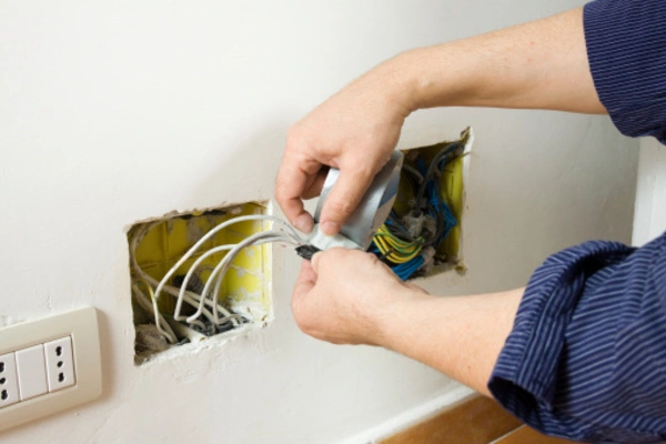Electrician in Everett, WA installing electrical components in a home