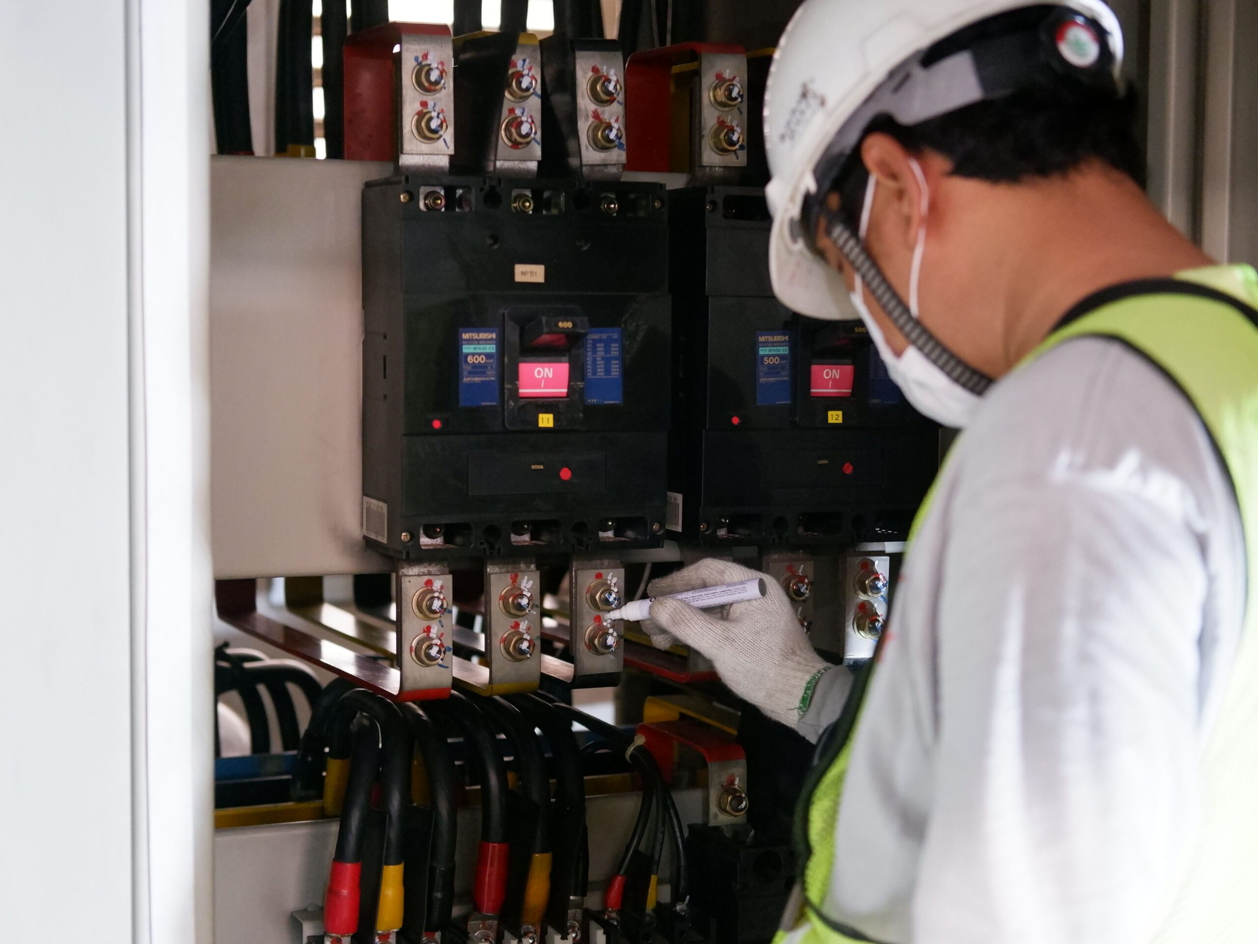 Licensed electrician performing residential electrical maintenance