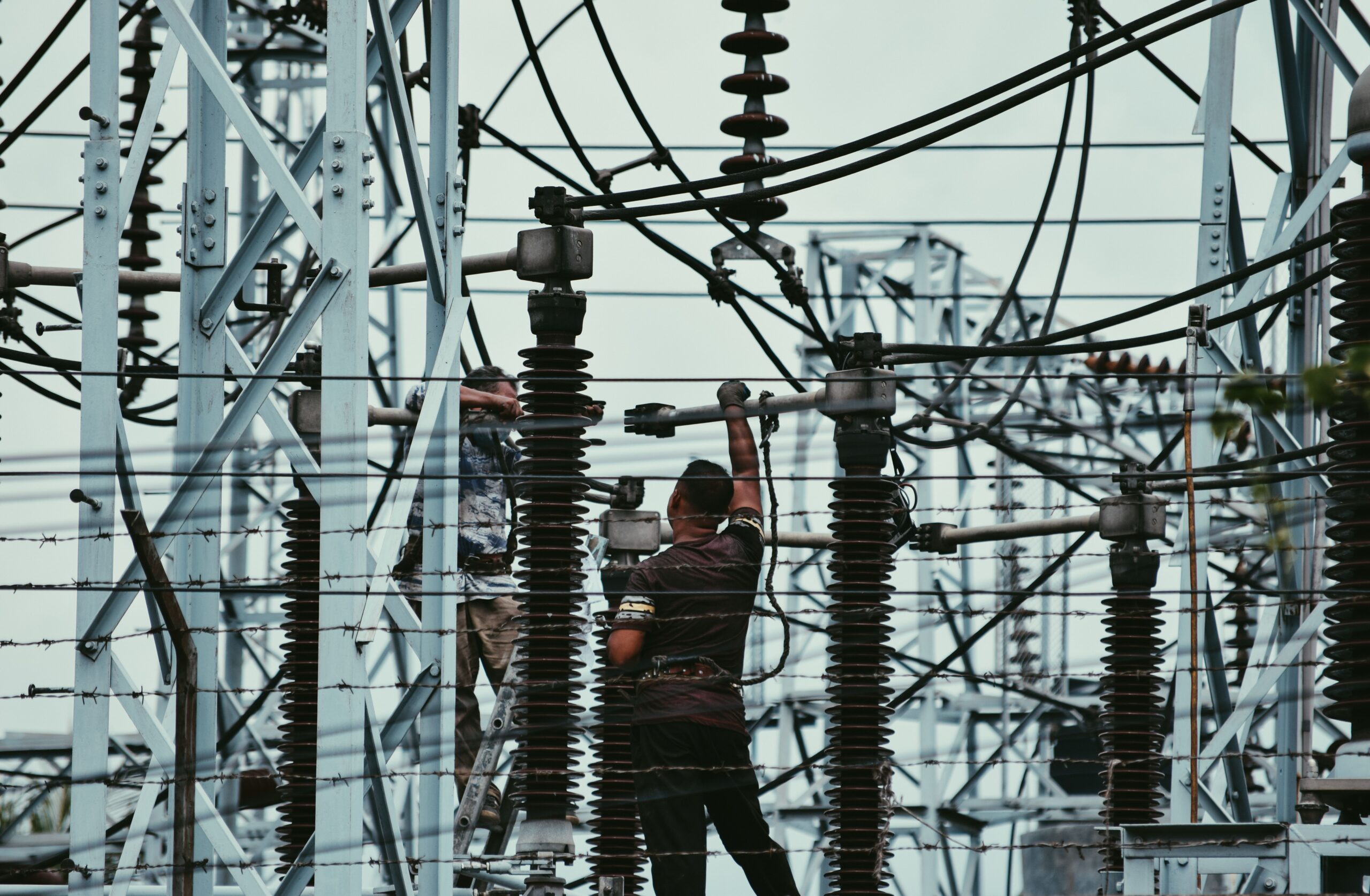 Electrician working on industrial electrical equipment